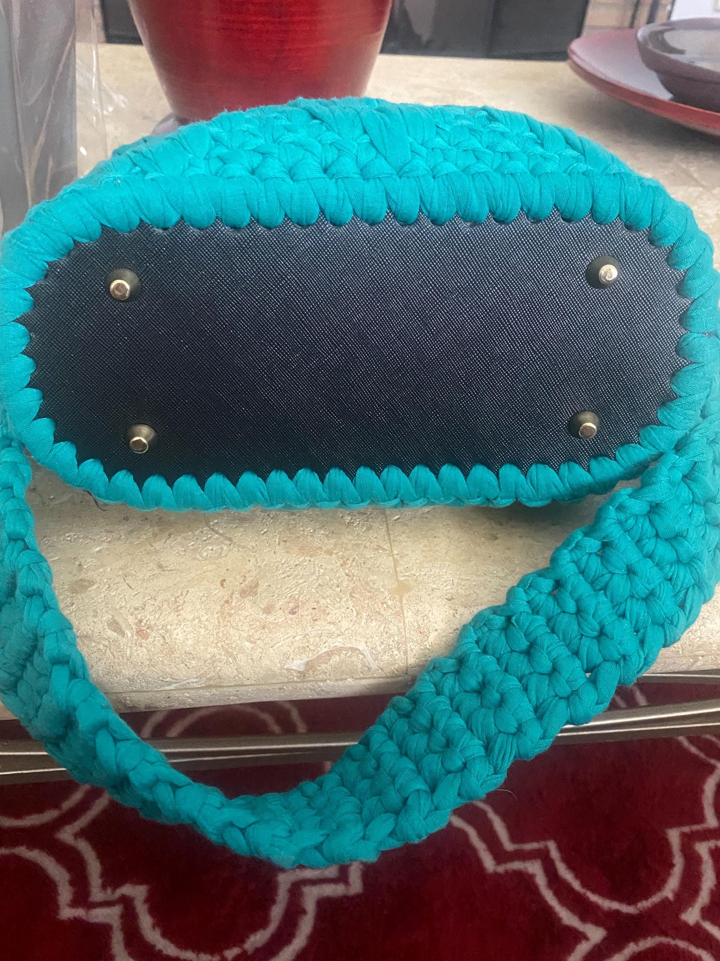 Handmade crocheted shoulder bag with leather bottom