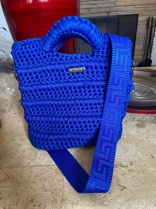 Blue crocheted purse with leather bottom