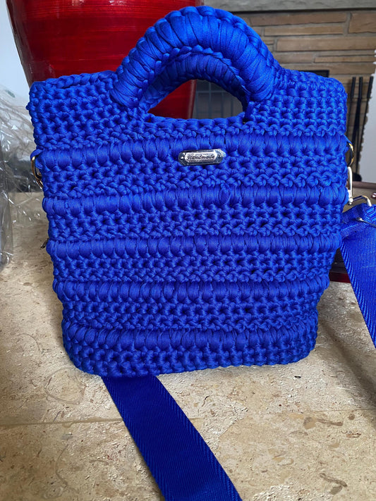 Blue crocheted purse with leather bottom